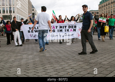 Iranian oppositors protesting against the Islamic government and demanding democracy in Iran, Branderburg Gate, Berlin, Germany Stock Photo