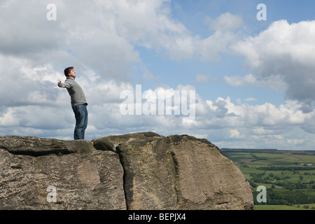 Man standing in wind Stock Photo
