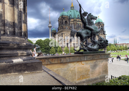 Facade of the Berliner Dom (Cathedral), with the TV Tower on the background from the Altes Museum portico, Berlin, Germany Stock Photo