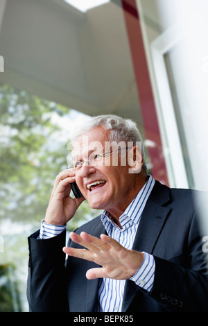 Senior Businessman Using Cellphone Stock Photo