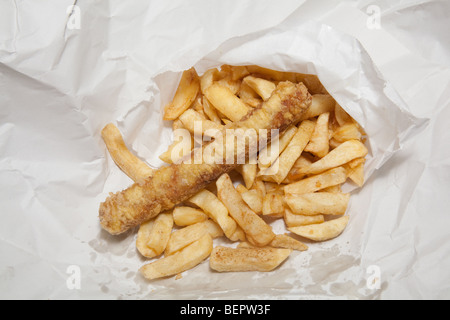 Take away sausage or saveloy and chips wrapped in white paper. Stock Photo