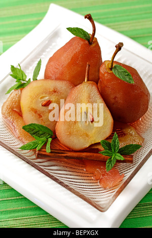 Poached pears in red wine. Recipe available. Stock Photo