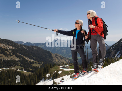 senior couple on ski tour in mountains Stock Photo