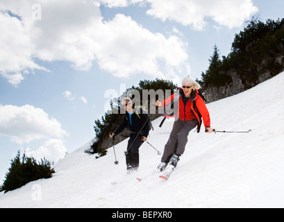 senior couple skiing in mountains Stock Photo