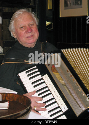 Nightlife in Vienna, Austria. An elderly accordion player Stock Photo