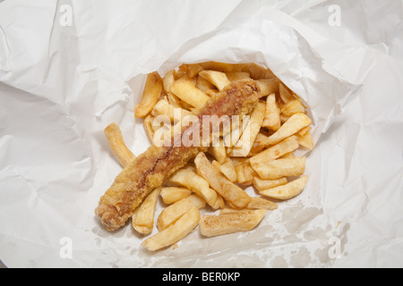 Take away sausage or saveloy and chips wrapped in white paper. Stock Photo