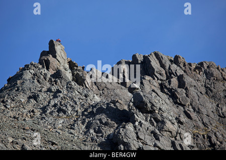 Hiker on the summit of Sgurr nan Gillean, Cuillin Hills, Isle of Skye, Scotland Stock Photo