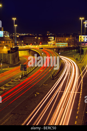 traffic light trails of vehicles heading too and from the city of leeds at night yorkshire uk Stock Photo