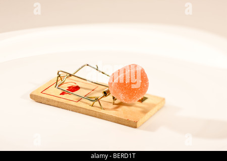 concept series: mouse trap with sweet jelly candy Stock Photo