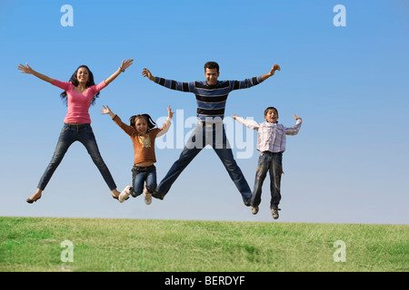 Family jumping in the air Stock Photo