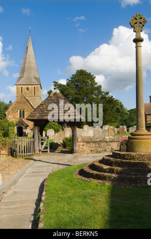 Shere St James village church Surrey with village cross now war memorial Surrey England. HOMER SYKES Stock Photo