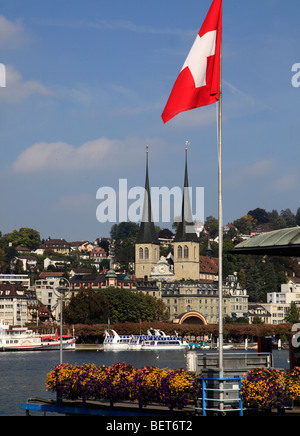 Switzerland, Lucerne, Luzern, lakeshore, cathedral, swiss flag Stock Photo