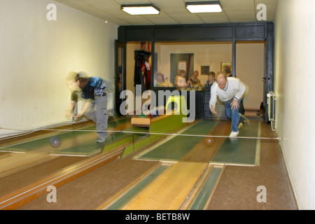 family playing at skittles Stock Photo