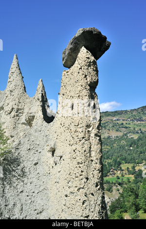 Pyramids of Euseigne, Valais / Wallis, Switzerland. Rocks of harder stone stacked on top of conglomerate due to water erosion Stock Photo