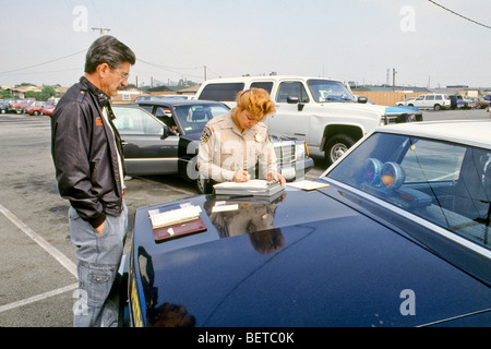 write citation fill out form for inspection failure safe safety concern law enforcement legal police cop freeway drive vehicle Stock Photo