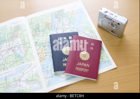 A map, two Japanese passports and a digital camera Stock Photo