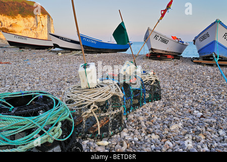 Lobster traps and colourful traditional caïques, wooden fishing boats on the beach at Yport, Normandy, Côte d'Albâtre, France Stock Photo