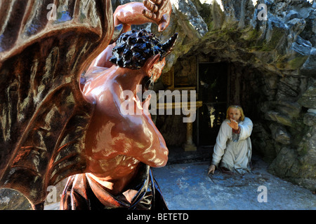 Statue of devil at the Grotto of St Anthony of Padua / Saint-Antoine de Padoue, Crupet, Namur, Belgian Ardennes, Belgium Stock Photo