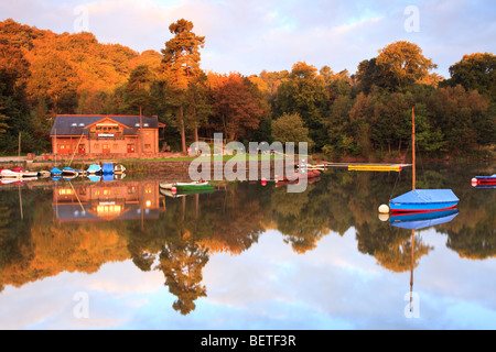 Morning light over the boats lying on the reservoir at Rudyard Lake in Staffordshire UK. Stock Photo