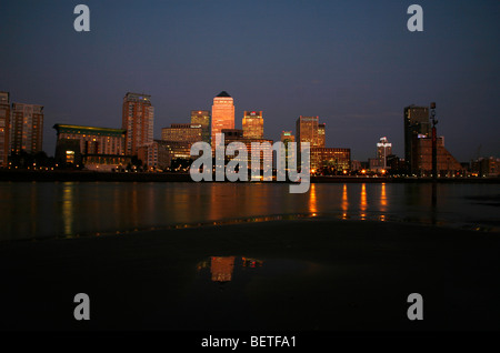 View across the River Thames from the foreshore at Rotherhithe to Canary Wharf, Docklands, London, UK Stock Photo