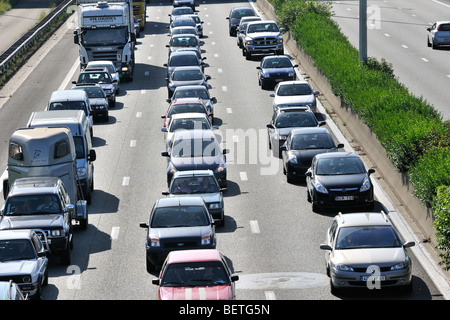 Cars queueing in highway lanes during traffic jam on motorway during summer holidays, Belgium Stock Photo