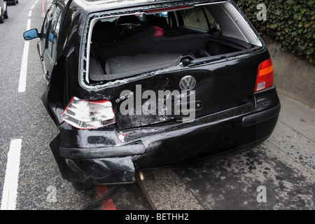Black VW golf totally written off, rear end damage Stock Photo