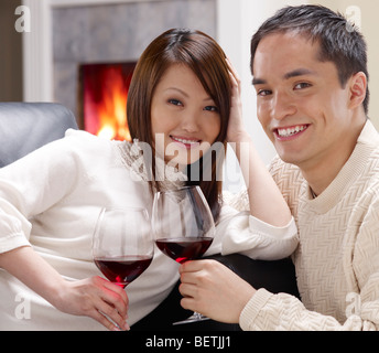 https://l450v.alamy.com/450v/betjj1/young-oriental-couple-drinking-wine-at-home-betjj1.jpg