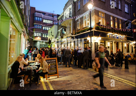 People drinking outside the White Horse pub. Soho. London. Britain. UK Stock Photo