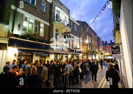 People drinking outside the White Horse pub. Soho. London. Britain. UK Stock Photo