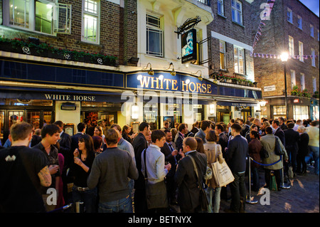 People drinking outside the White Horse pub. Soho. London. Britain. UK Stock Photo