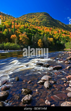 Riviere Jacques-Cartier,Jacques Cartier River,and valley surrounded by fall colours in Parc de la Jacques-Cartier,Quebec,Canada. Stock Photo