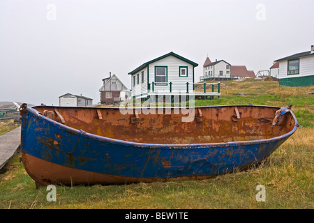 An old fishing boat hauled out on the shore at Battle Harbour,Battle Island at the entrance to the St Lewis Inlet,Viking Trail, Stock Photo