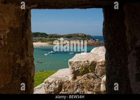 Old Grimsby, Tresco, viewed from the blockhouse and framed by a window, Isles of Scilly Stock Photo