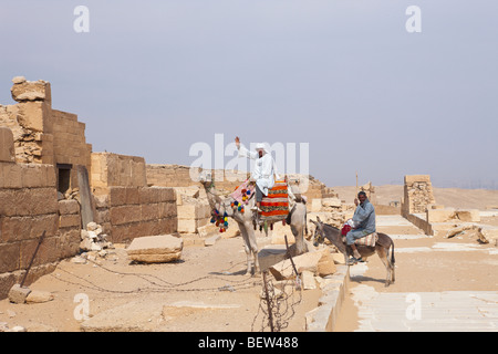 Egyptian in front of Mastaba near Saqqara Step Pyramid of Pharaoh Djoser, Saqqara, Egypt Stock Photo