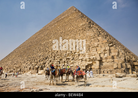 Camel Driver in Front of Pyramid of Cheops, Cairo, Egypt Stock Photo