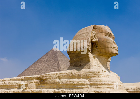 Great Sphinx of Giza against Cheops Pyramid, Cairo, Egypt Stock Photo ...