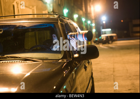 Paparazzi photographer in car Stock Photo