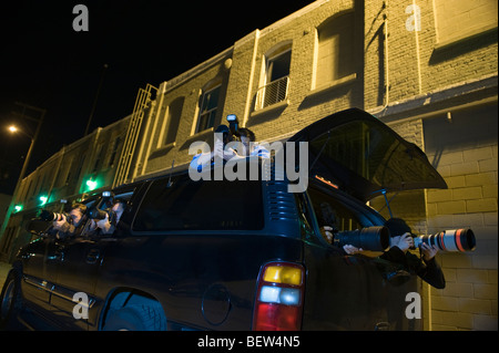 Paparazzi photographer in car Stock Photo