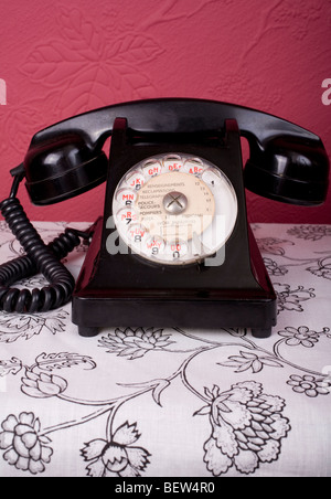 View of an old fashioned Bakelite phone, with the writing in French. Stock Photo