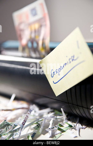 Adhesive note stuck on paper shredder Stock Photo