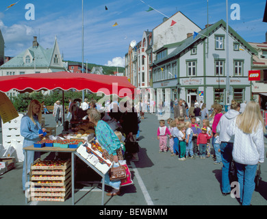 Girl selling strawberries in Torget (Market Place), central Harstad, Hinnøya, Troms, arctic Norway. Stock Photo