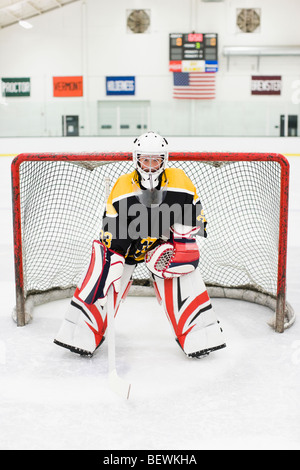 Goalkeeper at the goal post Stock Photo