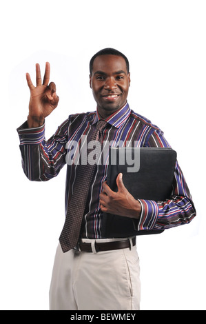 African American businessman giving the OK sign and holding a portfolio Stock Photo