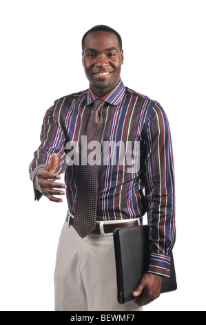 African American businessman extending a hand shake and holding a portfolio Stock Photo