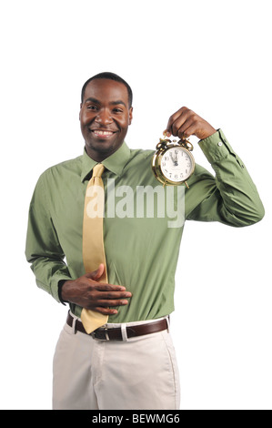 African American businessman holding a clock and celebrating lunch time Stock Photo