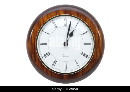 Round mahogany surround clock displaying two minutes past one o clock Stock Photo