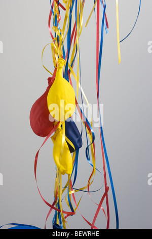 Deflated Party Balloons on a white background Stock Photo