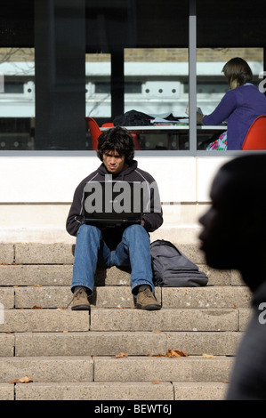 University student sat on steps Stock Photo