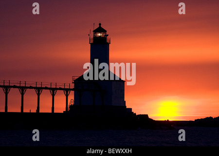 Silhouette of the lighthouse and catwalk in Michigan City Indiana at sunset Stock Photo