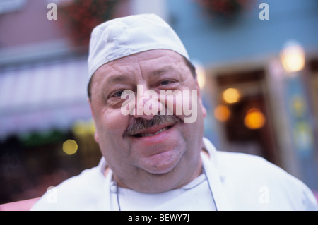 Butcher Gilbert Schluraff, in front of Restaurant Metzgerstuwa, Soultz, Alsace, France Stock Photo